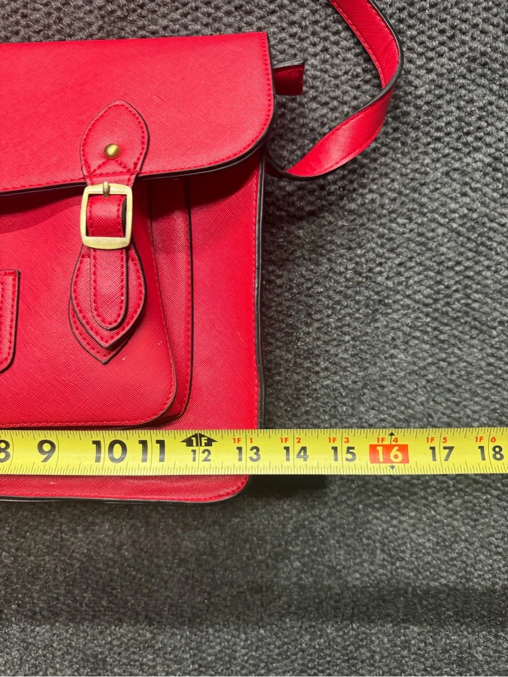 Classic Red Leather Satchel with Front Pocket and Adjustable Strap